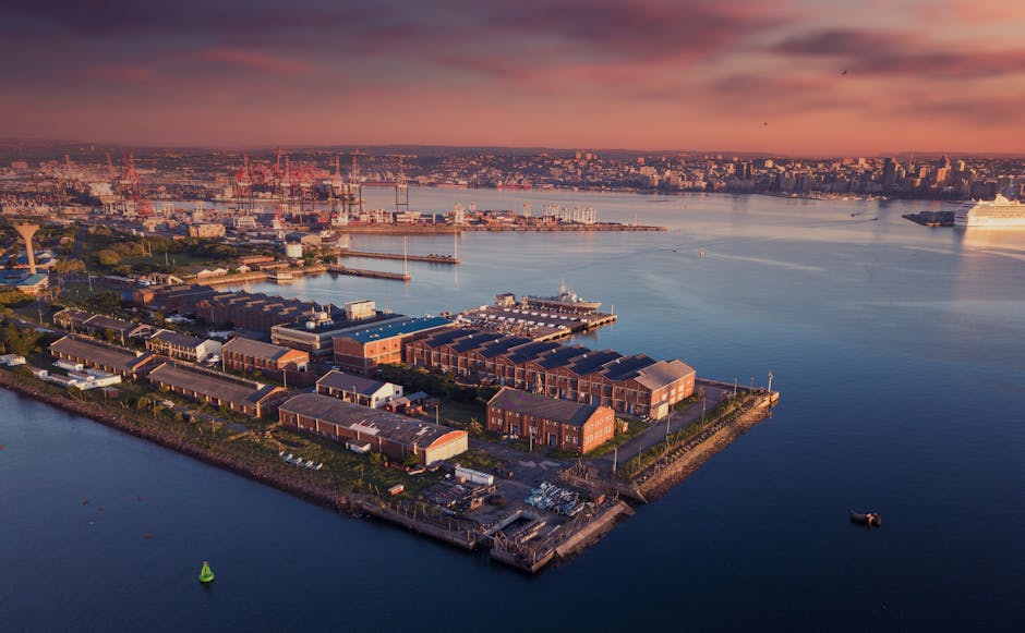 A serene aerial view of Durban harbor at sunset in South Africa, capturing the vibrant cityscape.